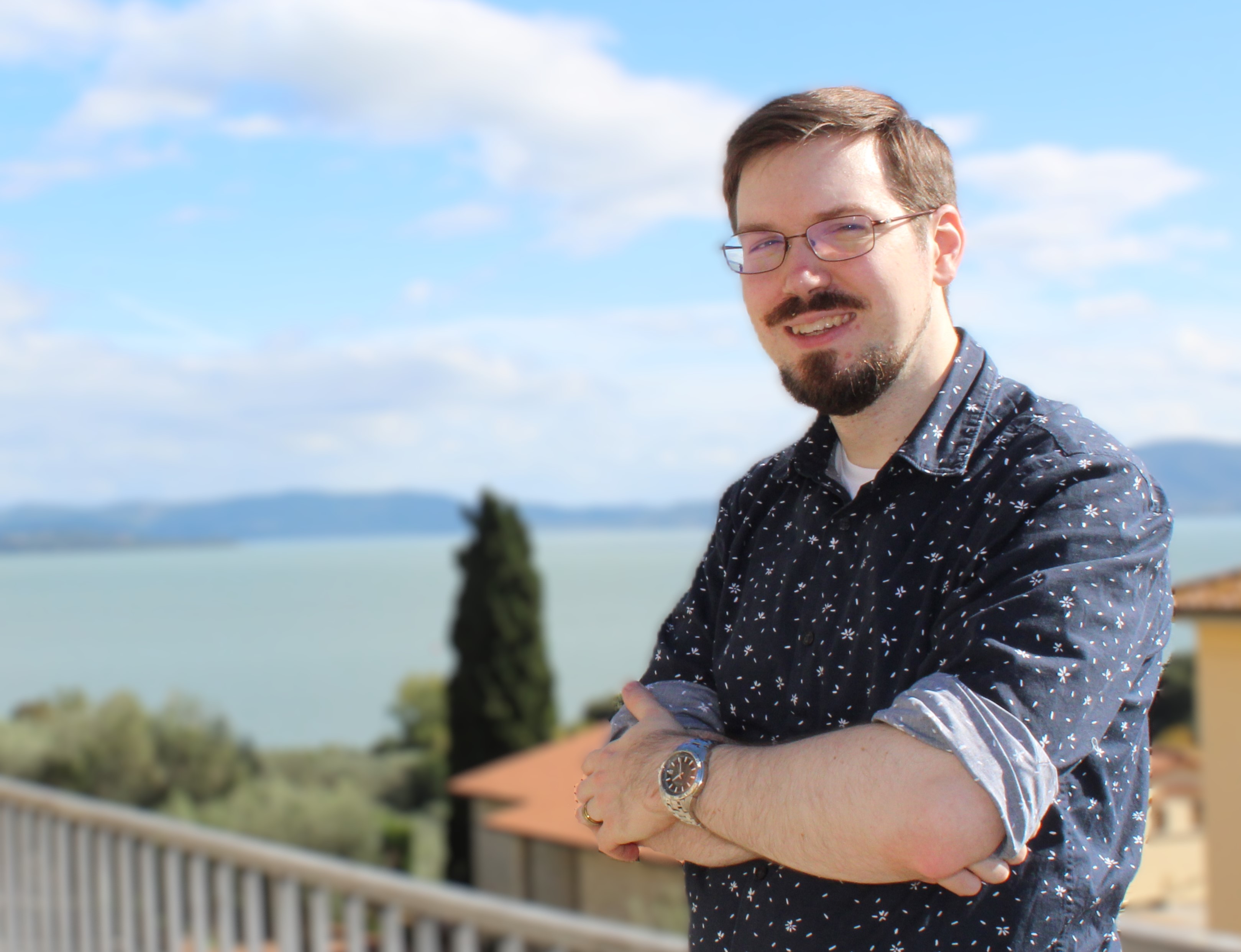 A photo of Justin Groves overlooking a lake.